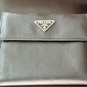 AUTHENTIC Prada Trifold wallet in black come
with card